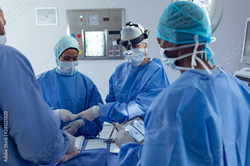 Surgeons performing surgery in operation theater