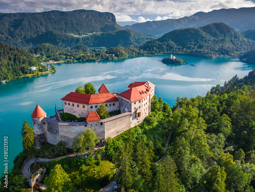 Bled, Slovenia - Aerial view of beautiful Bled Castle (Blejski Grad) with Lake Bled (Blejsko Jezero), the Church of the Assumption of Maria and Julian Alps at background on a summer day