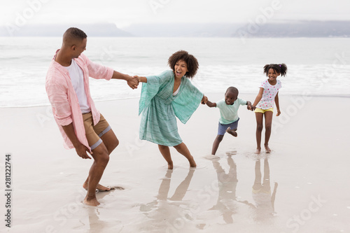 Family having fun on the beach