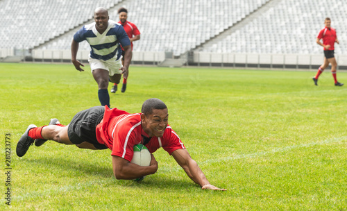 Group of diverse male rugby players playing rugby in stadium © wavebreak3