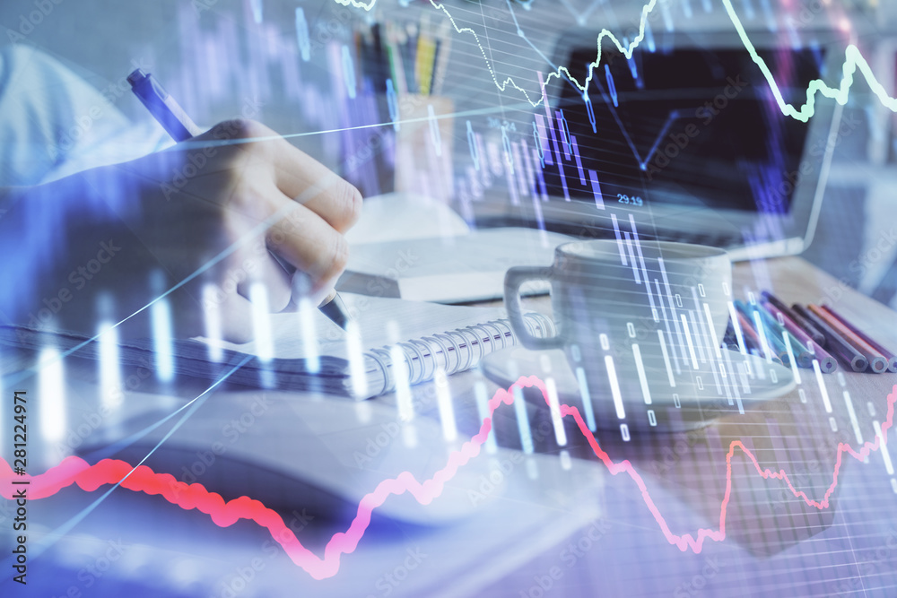 Financial chart drawn over hands taking notes background. Concept of research. Double exposure Financial chart drawn over hands taking notes background. Concept of research. Double exposure