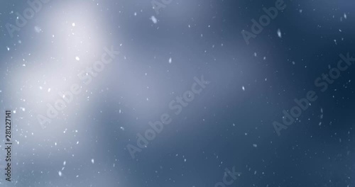 Falling snowflakes at winter, moving clouds in the background.