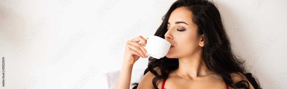 panoramic shot of beautiful girl drinking coffee with closed eyes panoramic shot of beautiful girl drinking coffee with closed eyes