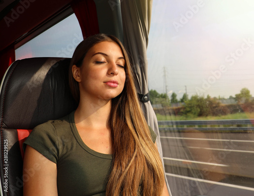 Billede på lærred Young beautiful woman sleeping sitting in the bus