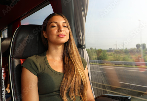 Obraz na plátně Young beautiful woman sleeping sitting in the bus