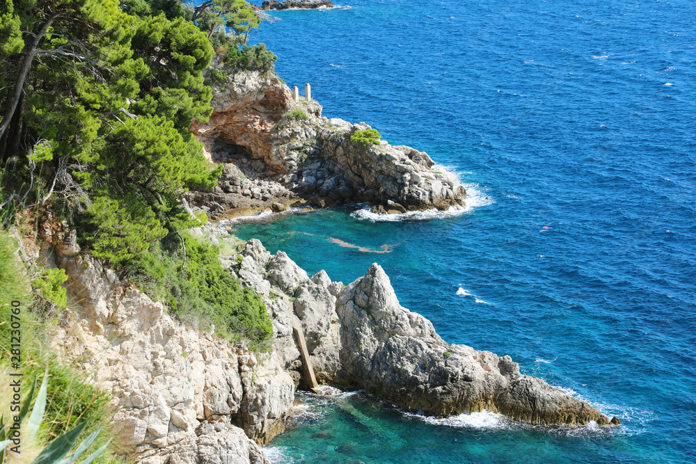 Dalmatian rocky coast with nature green trees with blue Adriatic sea, Croatia, Europe
