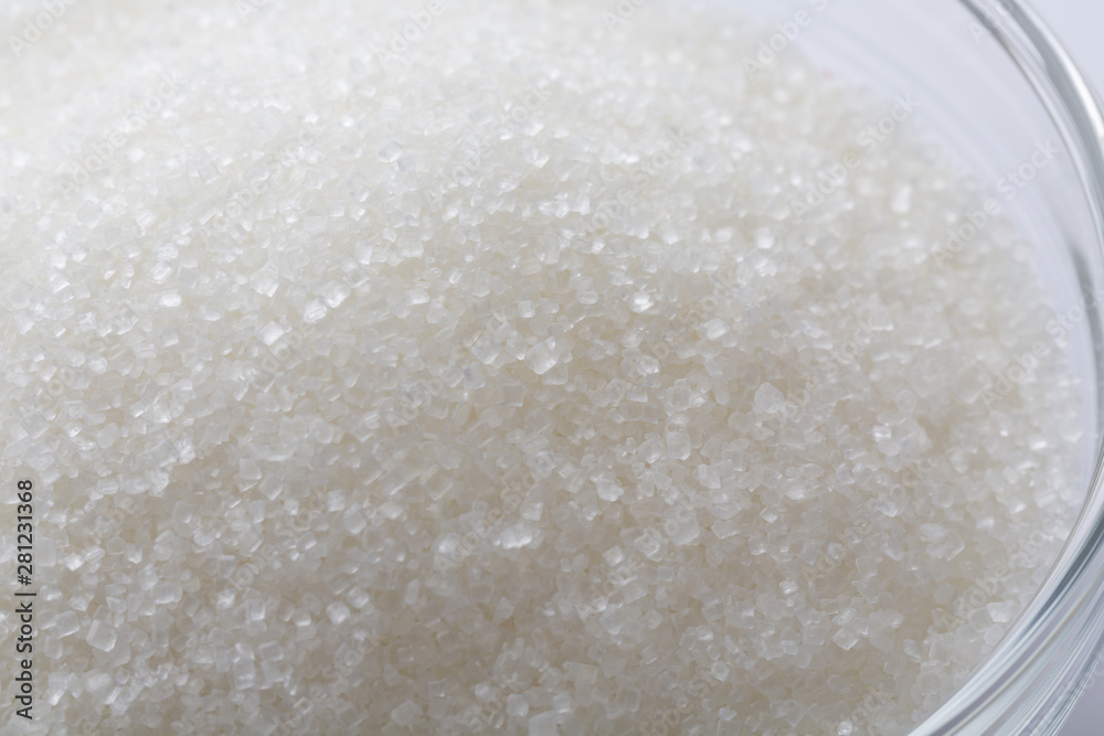 Closeup of sugar in glass bowl Closeup of sugar in glass bowl
