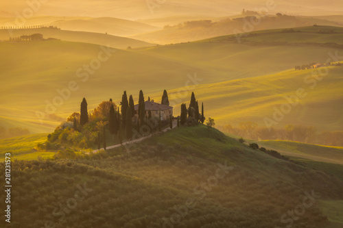 Fantastic sunny spring field in Italy  tuscany landscape morning foggy famous Cypress trees