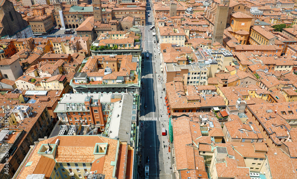 Bologna aerial cityscape of old town from the tower with Rizzoli street foreground, italian medieval landscape