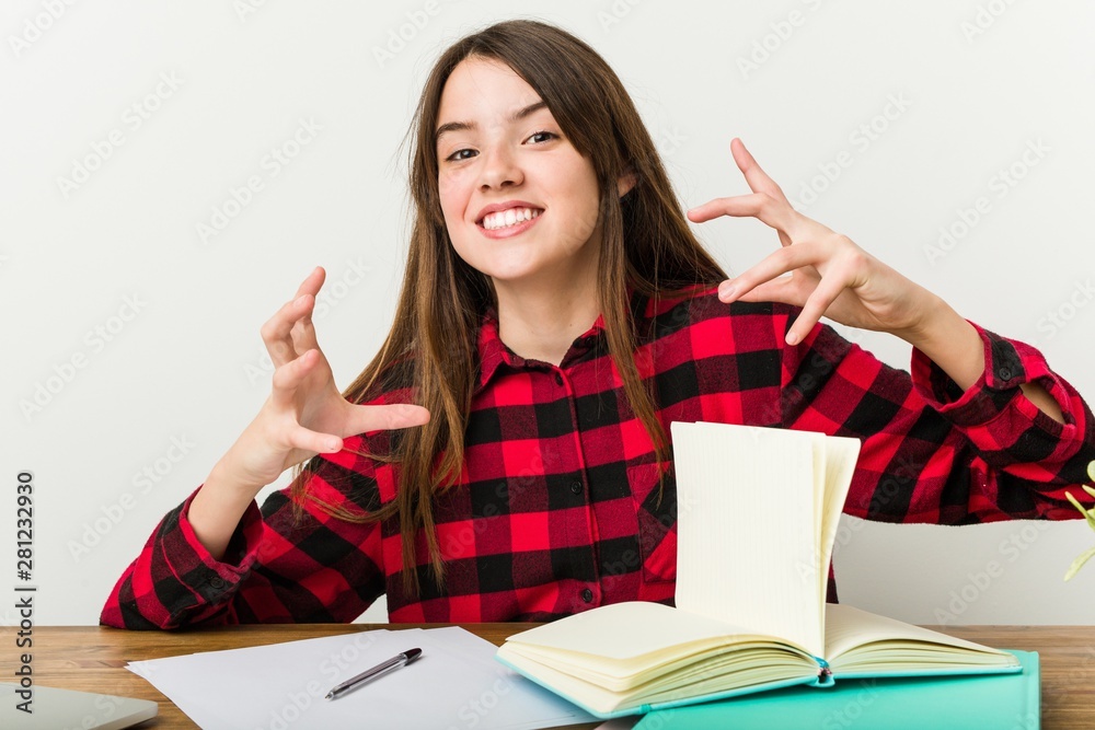 Young teenager going back to her routine doing homeworks screaming with rage. Young teenager going back to her routine doing homeworks screaming with rage.