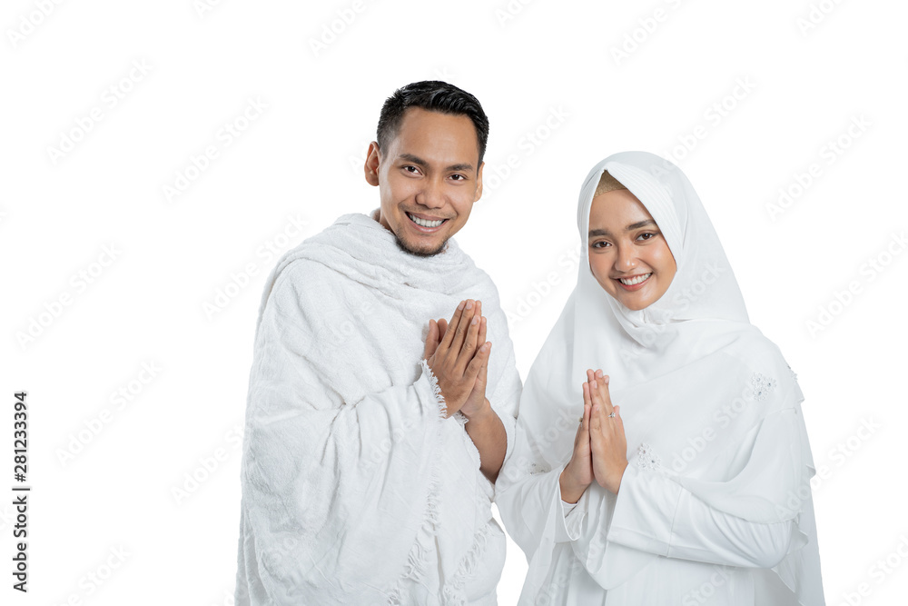 muslim pilgrims wife and husband wearing white traditional clothes for Ihram ready for Hajj