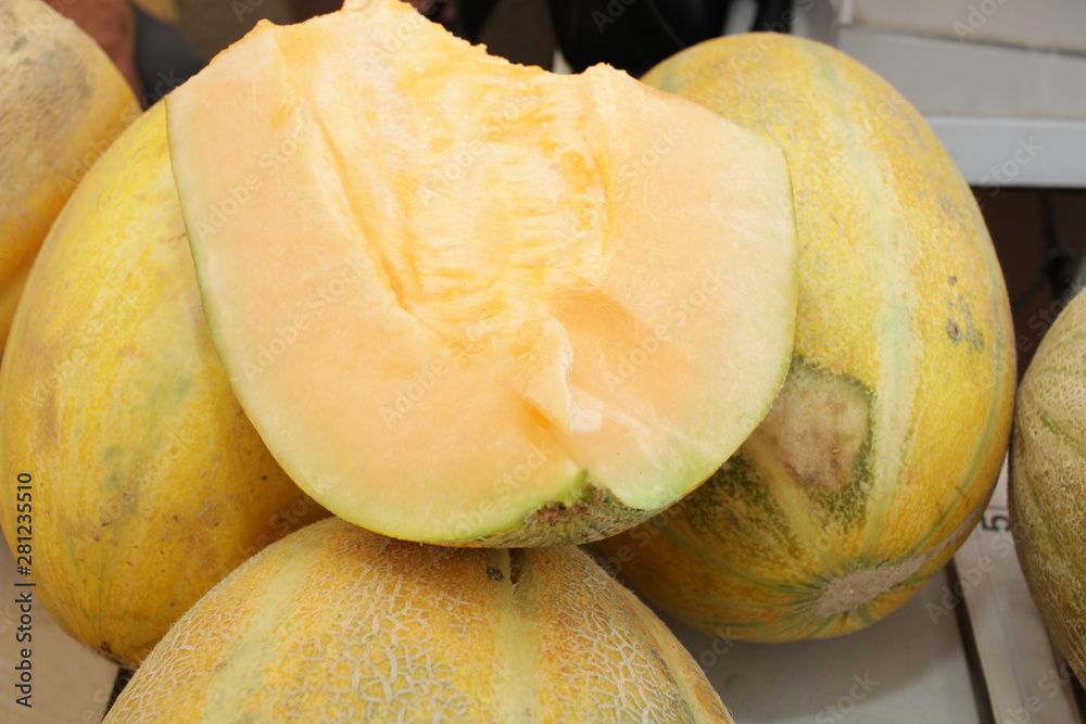Melon, honey melon. Melons background texture. Fresh organic yellow fruits. Vegetarian or healthy eating concept.