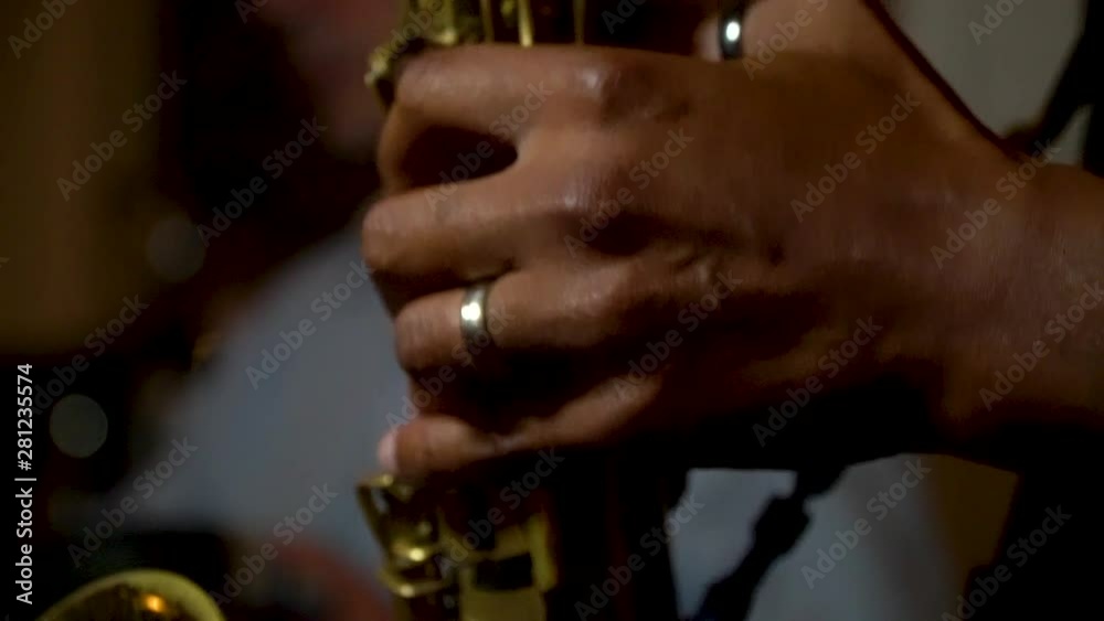 playing saxophone, close up view playing saxophone, close up view