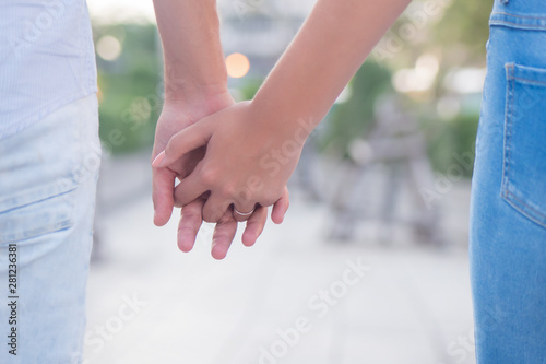 young couple lovers walking hand in hand