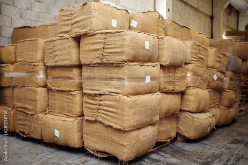 Photography Photo of dried tobacco leaves in cloth sack for cigarette industry