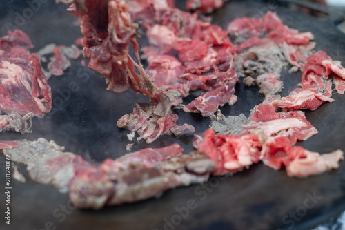 Red beef meat bbq fry  Philadelphia cheesesteak beefsteak top round pan close-up