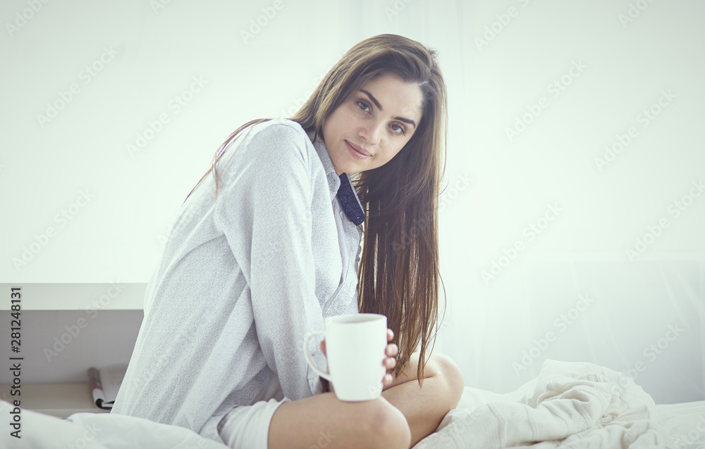 Young beautiful happy brunette woman in black silk dressing gow Young beautiful happy brunette woman in black silk dressing gow