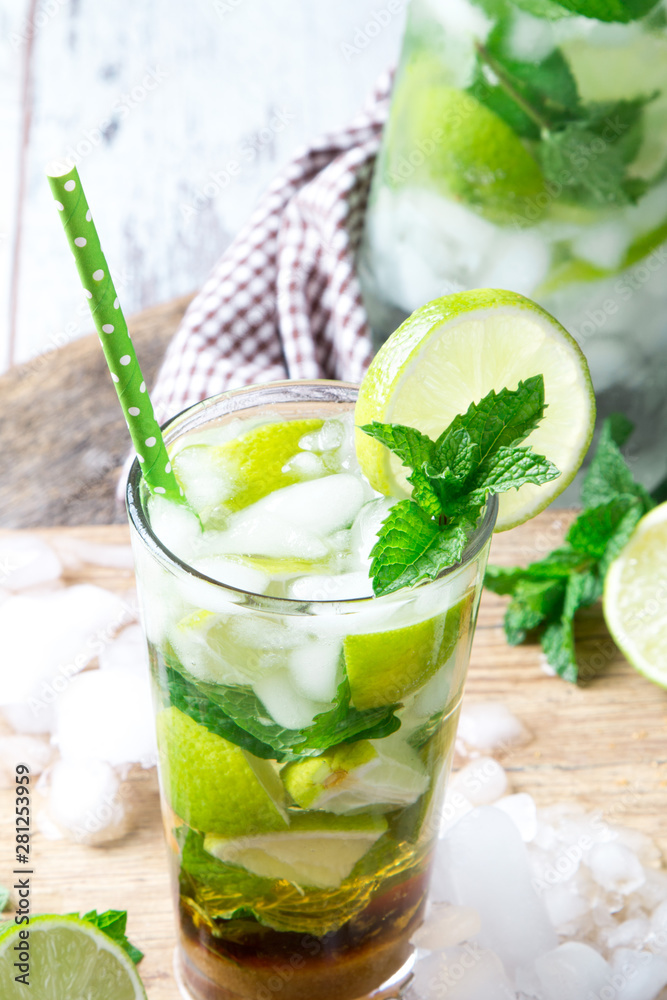 Mohito lime drinks on wooden with blur beach background