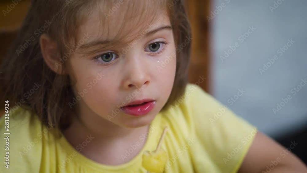 beautiful little girl eating a delicious colorful ice cream beautiful little girl eating a delicious colorful ice cream