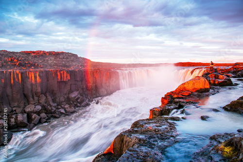 Charming beautiful waterfall Selfoss in Iceland with rainbow. Exotic countries. Amazing places. Popular tourist atraction.