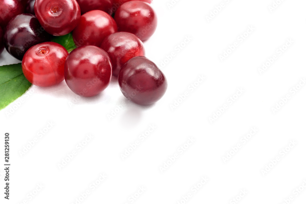 Ripe cherry berries on a white background, close-up Ripe cherry berries on a white background, close-up