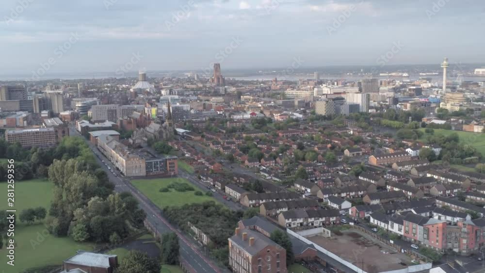 Aerial cityscape across Liverpool city buildings, cathedral, radio city tower along skyline. Lowering pull back. Aerial cityscape across Liverpool city buildings, cathedral, radio city tower along skyline. Lowering pull back.