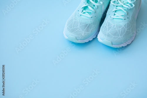 Mint sneakers on light blue trendy background