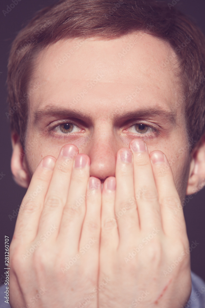 Speak no evil concept - Face of men covering his mouth. Speak no evil concept - Face of men covering his mouth.