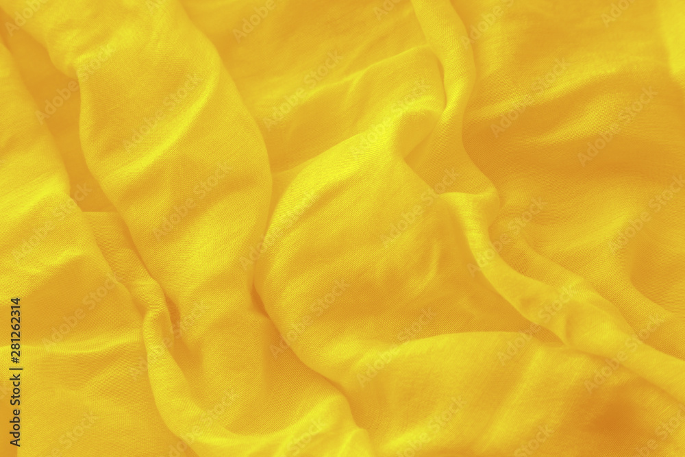 Textured background from light cotton natural fabric.