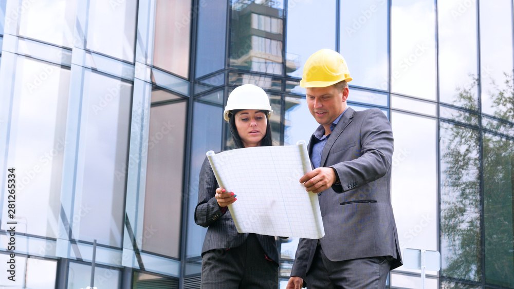 Team of architects and engineer in group on construciton site check documents and business workflow. Engineer inspection in workplace for architectural plan. Concept of: Woman, Man, Suite, Business. Team of architects and engineer in group on construciton site check documents and business workflow. Engineer inspection in workplace for architectural plan. Concept of: Woman, Man, Suite, Business.
