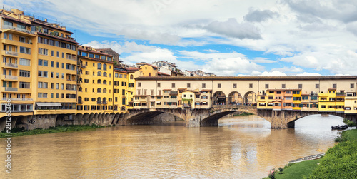 Ponte Vecchio  Florence  Itlay  in day time  colorful houses and blue sky