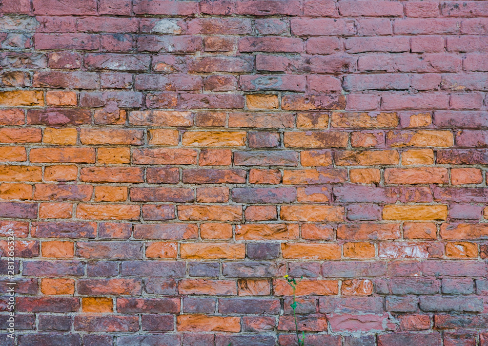 Background of old red brick. The wall of the old house without plaster. Brick is a durable material, but it collapses without a protective layer of plaster. Then the whole wall collapses. Background of old red brick. The wall of the old house without plaster. Brick is a durable material, but it collapses without a protective layer of plaster. Then the whole wall collapses.