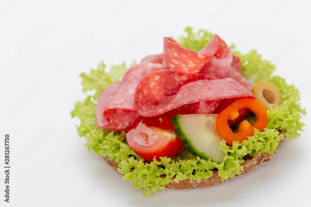 Sandwich with salami sausage on white background. Sandwich with salami sausage on white background.