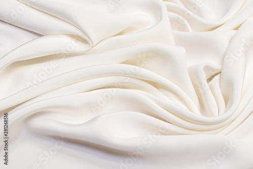 Texture of ivory silk fabric. Background, pattern.