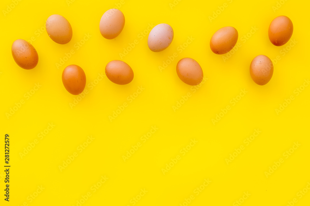 Fresh eggs for organic food on yellow background top view mockup Fresh eggs for organic food on yellow background top view mockup