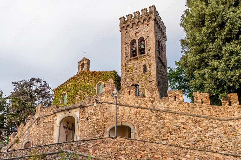 The facade of the church of San Lorenzo in the upper part of the medieval village of Castagneto Carducci, Tuscany, Italy