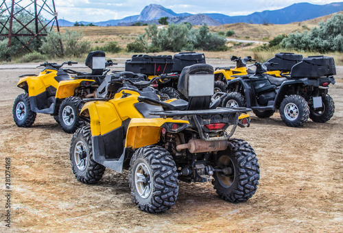 ATVs in the parking lot in the field
