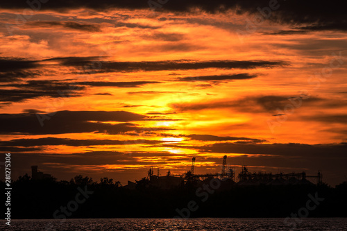View of dramatic burning orange cloudy sky during the sunset period. Natural view and scenic photo.