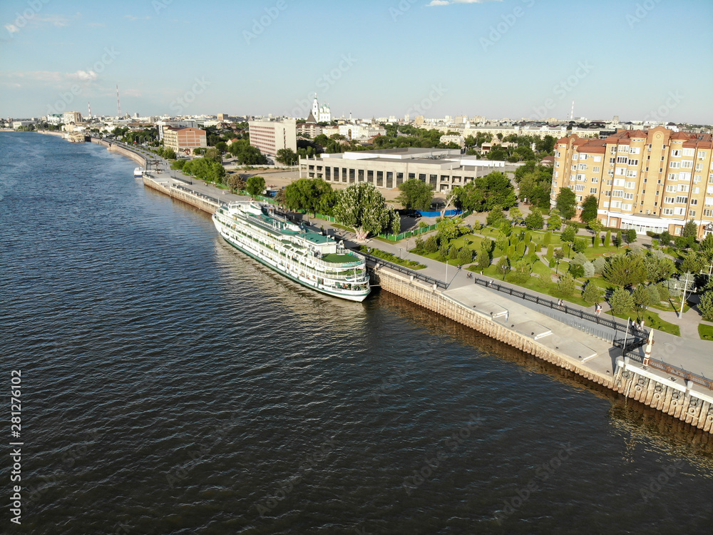 Astrakhan. A cruise ship. The central embankment of the city. Monument to Peter 1 on the park for rest and walks. Panorama of the city of Astrakhan.