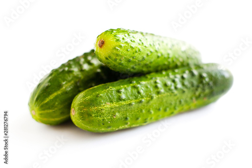 fresh small cucumbers on white background  homemade gherkins isolate  