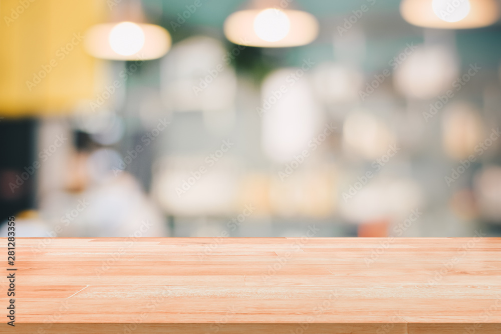 Blank Wood Table Top Reception Counter or Cash Counter on blurred background for montage product present Blank Wood Table Top Reception Counter or Cash Counter on blurred background for montage product present
