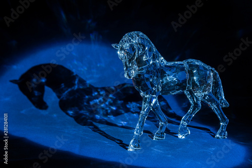 Crystal horse on a blue background