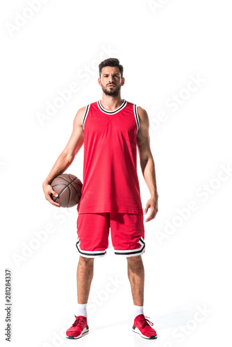 sportive basketball player holding ball and looking at camera Isolated On White