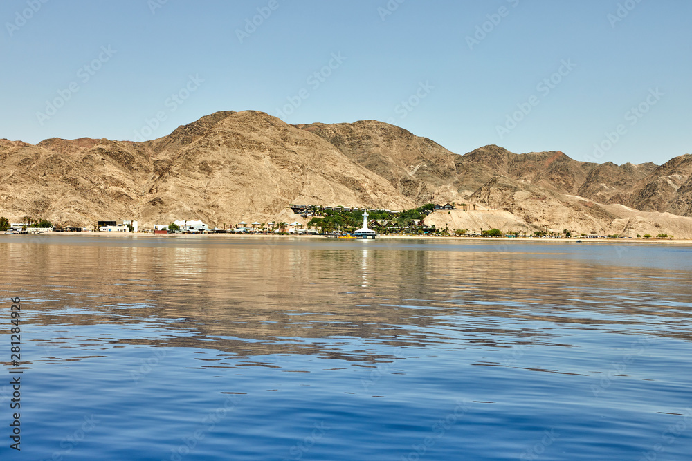 View from the luxury yacht to the Red Sea. Hotels for tourists, boats and yachts for a holiday.