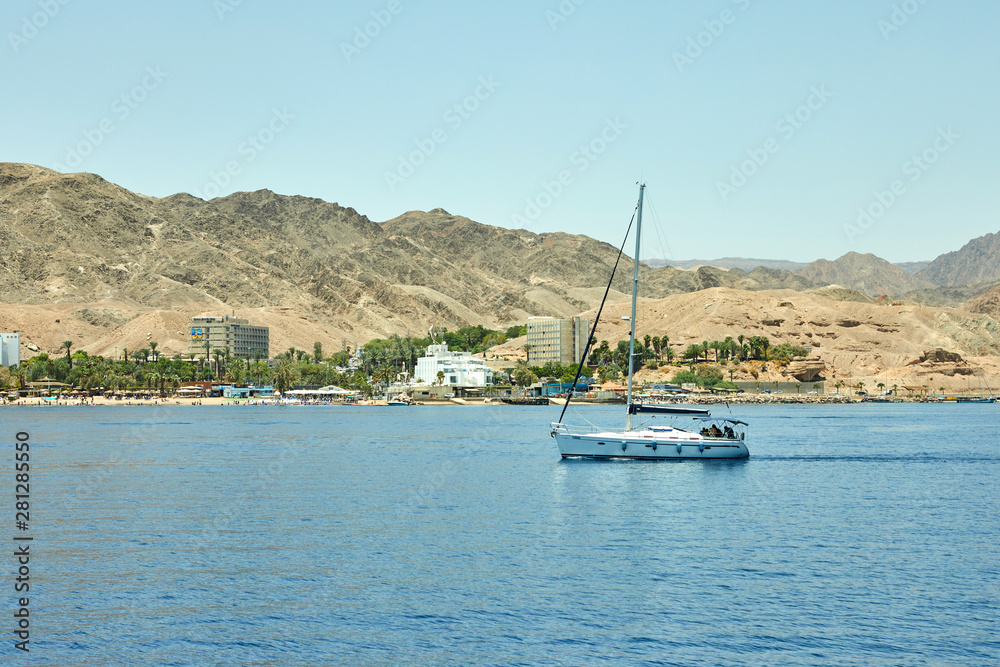 View from the luxury yacht to the Red Sea. Hotels for tourists, boats and yachts for a holiday.