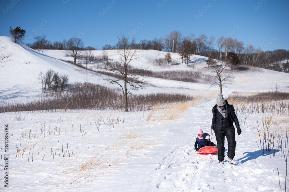 Mom Pulls Sled with Kids After Sledding