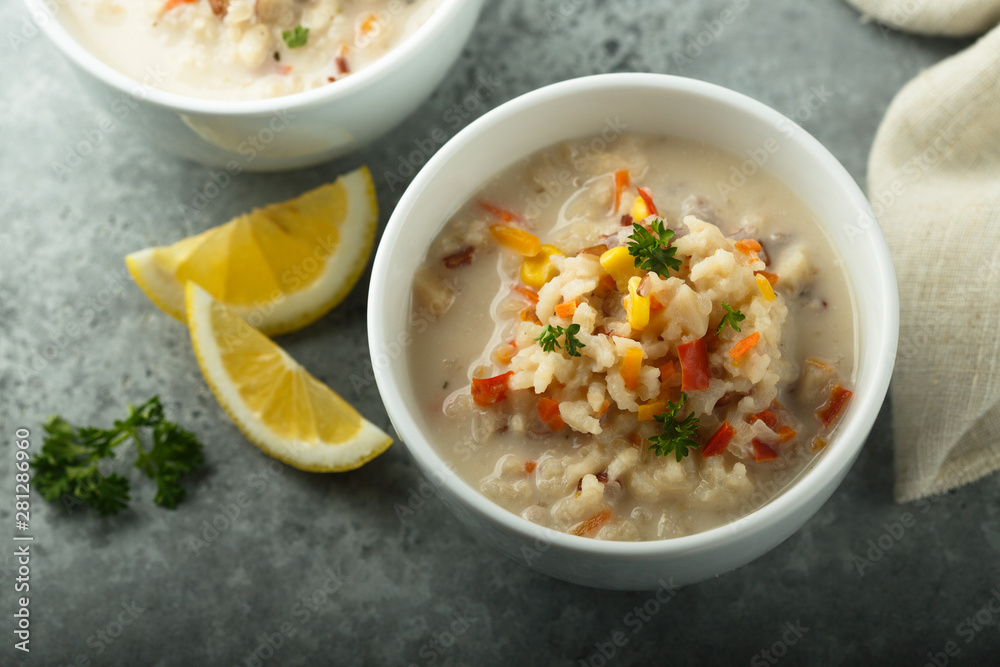 Homemade chowder soup in white bowls