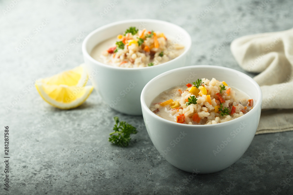 Homemade chowder soup in white bowls Homemade chowder soup in white bowls