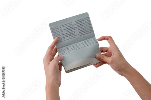 two hands open passbook for checking balance of staement with white background and clipping path photo