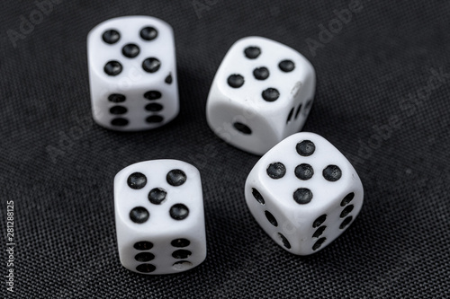 Dice Rolled 4 Fives on Black Table